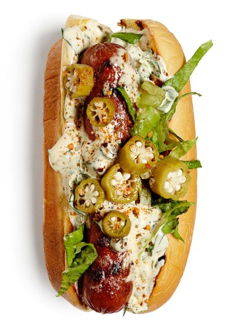 Grilled hot dogs on grilled buns with remoulade sauce or Creole mustard, shredded romaine and pickled okra. Sprinkle with Creole seasoning. Grilled Hot Dogs, Grilling Hot Dogs, Gourmet Hot Dogs, Hot Dogs Recipes, Creole Mustard, Hot Dog Toppings, Pickled Okra, Burger Dogs, Remoulade Sauce