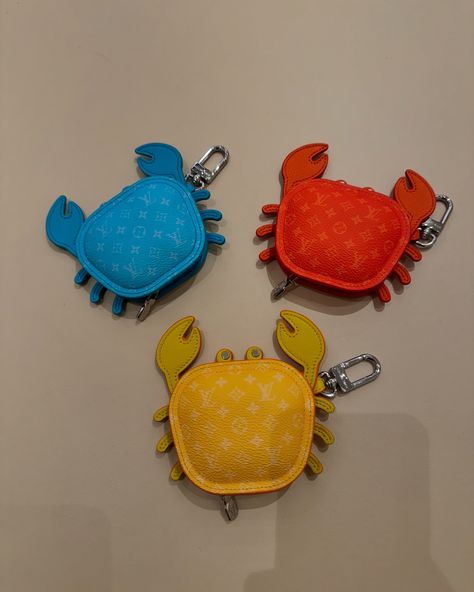 Available in four vibrant colors, this eminently giftable LV Crab Bag Charm brings an uplifting burst of summer color to a favorite bag. A beautifully crafted addition to the growing menagerie of Louis Vuitton animal charms, this playful piece is meticulously assembled from leather with an allover Monogram canvas finish to the body. Introducing the LV Turtle pouch, a fun, functional accessory. Made from Monogram canvas, colorful leather and a silver-tone snap hook, the friendly creature can... Crab Bag, Summer Color, Functional Accessories, Colored Leather, Summer Colors, Monogram Canvas, Crab, Silver Tone, Vibrant Colors