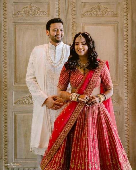 Dhwiti stuns in a breathtaking red lehenga, perfectly complemented by Kanai’s regal white sherwani.

#sbtrides #seventybytwo #weddingphotographer #weddinginspiration #lehengalove #pastelweddings Red And Ivory Outfit, Ivory Sherwani Grooms, Red Sherwani, White Sherwani, Sherwani Groom, Wedding Stories, Red Lehenga, Tarun Tahiliani, Pastel Wedding