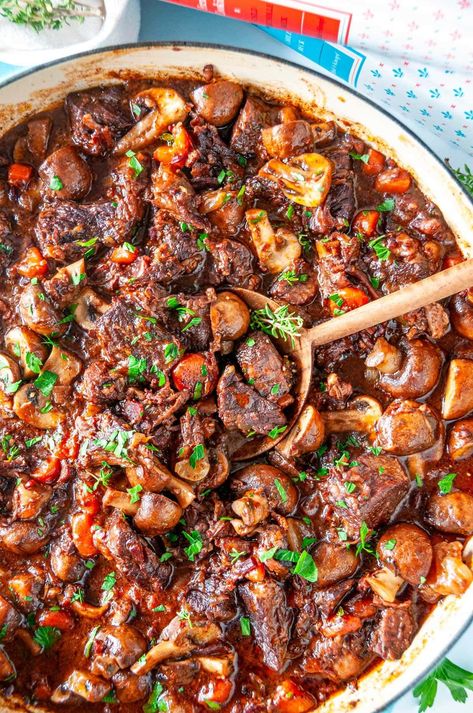 Impress your friends and family with Julia Child's world renowned Beef Bourguignon recipe that will make any get together unforgettable. This fork tender, fall apart beef simmered in a rich red wine flavored sauce is easier to make than you think and 100% worth the wait! From aberdeenskitchen.com Beef Bourguignon Recipe, Julia Childs, Wine Flavors, Chicken Dishes Easy, One Pot Dishes, Party Dishes, French Cooking, Julia Child, Beef Dinner