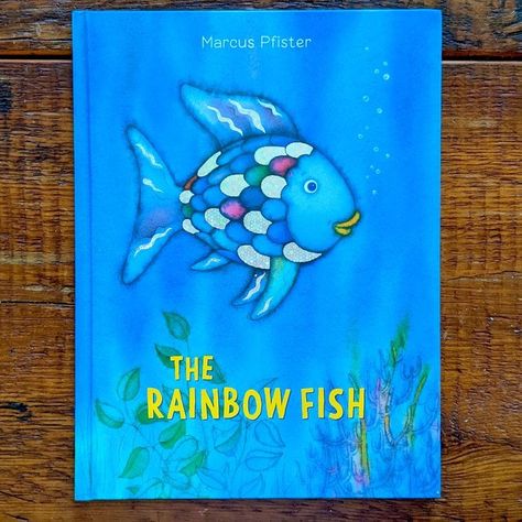 This 1990s childhood classic might bring fond memories for some, but one teacher has sparked a reexamination of its message. The post Here’s Why This Teacher Says the Book “Rainbow Fish” Might Be Outdated appeared first on Reader's Digest. Rainbow Fish Book, The Rainbow Fish, Fauna Marina, Classic Childrens Books, Rainbow Fish, Beautiful Fish, Book Fair, Big Book, Board Books