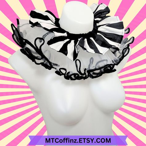 Get ready to clown around in style with this frilly ruffled collar! Whether you're gearing up for a spooky circus, a fun photo shoot, or a wild cosplay adventure, this collar has got you covered. It's fully adjustable buy tying  it with the long ribbons and will fit any neck size. You can leave the bow long and position it to the front back or side.  I can make these in just about any color combo you can think of so if you love the style but not the color, drop me a message and we can work toget Black Clown Dress, Clown Ruffle Collar Diy, Spooky Clown Costume, Purple Clown Outfit, Pink Clowncore, Clowncore Accessories, Clown Costume Aesthetic, Clown Neck Ruffle, Clown Ruffle Collar