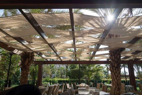 Fabric canopies are a great way to add a pergola cover to an existing outdoor structure. It's not totally waterproof, but will keep the patio dry in a light rain. #fromhousetohome   #decks #patios Pergola Cover Ideas, Pergola Cover, Shade Sail Installation, Retractable Pergola Canopy, Rustic Pergola, Farmhouse Patio, Outdoor Structure, Retractable Pergola, Building A Pergola