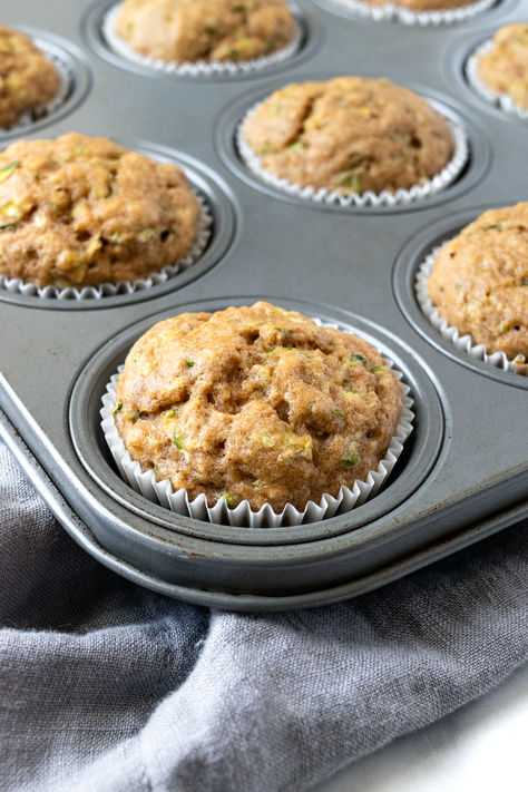 Applesauce Zucchini Muffins in a muffin tin. Sugar Free Zucchini Muffins, Applesauce Zucchini Muffins, Apple Zucchini Muffins Healthy, Zucchini Applesauce Muffins, Healthy Zucchini Muffins Applesauce, Zucchini Applesauce, Zucchini Oatmeal Muffins, Zucchini Mini Muffins, Zucchini Carrot Apple Muffins