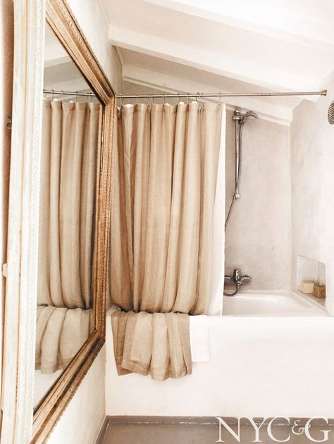 Tour a South-of-France Getaway So Lovely It Hurts via @mydomaine Shower Curtain Alternative, Curtain Alternatives, French Bathroom, Homes In France, French Country Bathroom, Plastic Curtains, Gilded Mirror, Cool Shower Curtains, Pretty Bathrooms