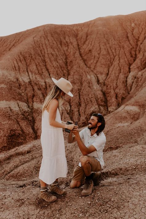 There’s nothing we love more than a properly documented surprise proposal! Jake got down on one knee and proposed to his college sweetheart Shelby amongst the stunning cliffs of Ghost Ranch in Abiquiu, New Mexico. Arizona Proposal, Man On One Knee Proposing, Sunrise Beach Proposal, Laguna Beach Proposal, Cannon Beach Proposal, Cute Proposal Ideas, Unique Proposals, Cute White Dress, Proposal Photography