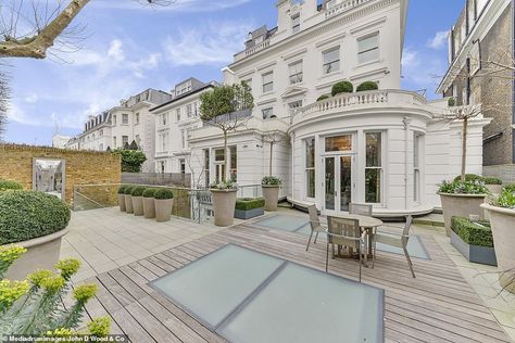 The property's rear exterior with ample space for entertaining. It currently features deck... Kensington Mansion, 10 Bedroom House, London Homes, Kensington Palace Gardens, Wine Vault, London Mansion, Luxurious Homes, Palace Garden, London Property