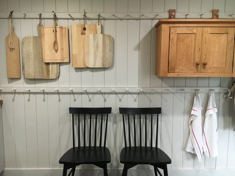 Shaker style peg racks in a guest home kitchen.  Stone House Revival - Season One. Peg Shelf Decor, Peg Rails, Stone House Revival, Shaker House, Shaker Peg Rail, Peg Shelf, Kitchen Stone, Peg Rail, Kitchen Cabinet Trends