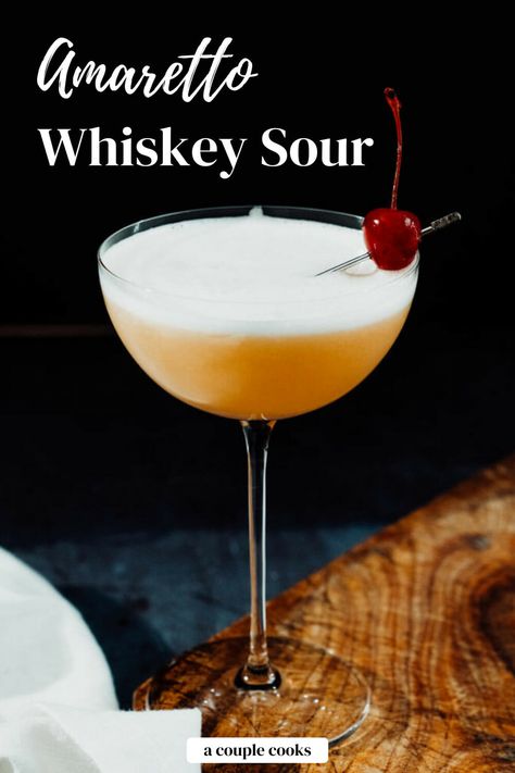 This amaretto whiskey sour combines the best of these two classic cocktails! The blend of two liquors makes a perfectly balanced drink. #amaretto #whiskey #whiskeysour #amarettosour #amarettowhiskeysour #cocktail #easycocktail #cocktailrecipe Bourbon Amaretto Cocktails, Cocktails Amaretto, Alcoholic Drinks Cocktails, Amaretto Drinks, Vodka Sour, Boozy Treats, A Couple Cooks, Amaretto Sour, Whisky Sour