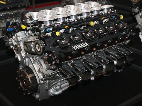 In 1989, Yamaha Motor began its challenge in Formula 1, the pinnacle of automobile racing, as an engine supplier. Exclusively developed V8, V10 and V12 engines were supplied to the renowned Brabham, Jordan, Tyrrell and Arrows F1 teams. The OX99 5-valve V12 F1 engine pictured here was supplied to the Brabham and Jordan teams. In 1992, Yamaha developed the "OX99-11" production supercar that mounted this GP engine. In all, Yamaha's F1 challenge lasted for nine years. During that time, Yamaha engin Yamaha Engines, Automobile Engineering, V12 Engine, Yamaha Motor, Motor Engine, Performance Engines, Race Engines, Combustion Engine, Japanese Cars