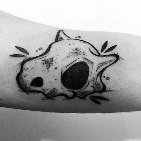 Inner Arm Bicep Gamer Guys Tattoo Designs Cubone Tattoo Design, Pokemon Halloween Tattoo, Cubone Skull Tattoo, Pokemon Tattoo Black And White, Dinosaur Skull Tattoo, Pokemon Skull, Cubone Tattoo, Cubone Skull, Charmander Tattoo