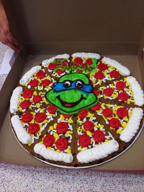 Ninja turtle cookie cake Simple Ninja Turtle Cake, Tmnt Birthday Cake Ideas, Ninja Turtle Cookie Cake, Tmnt Birthday Cake, Tmnt Cake Birthdays, Ninja Turtle Cake Ideas, Pizza Cookie Cake, Ninja Turtles Birthday Cake, Turtle Pizza