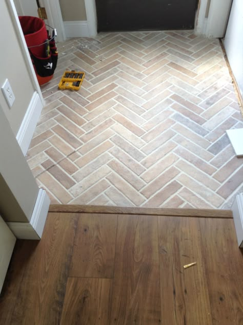 White Glazed Terracotta Tile, Herringbone Tile Entry, Entrance Ceramic Floor, Herringbone Tile Foyer, Small Entry Tile, Brick Flooring Entryway, Tile Doorway Entry, Small Foyer Tile Ideas Entryway, Living Room Herringbone Floor