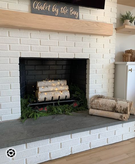 Fireplace Birch Log Decor, Birch Fireplace Logs, Logs In Fireplace With Fairy Lights, Faux Fireplace With Bench, Light Wood Fireplace Mantle, Logs And Candles In Fireplace, Fake Wood Fireplace Logs, Fireplace With Birch Logs, Fireplace Faux Logs