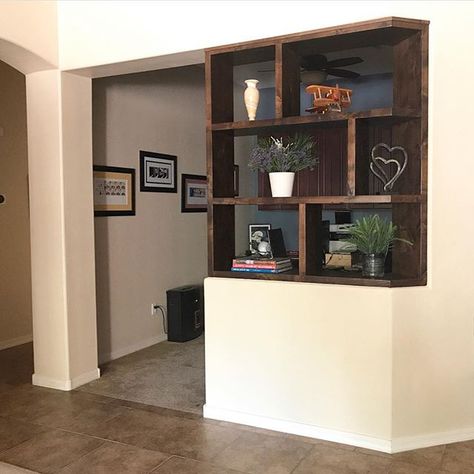 Custom built-in shelving unit on top of a pony wall. See the before and after! #shelves #builtins #custom Pony Wall Ideas, Hall Tree Bench, Wall Bookshelf, Custom Bookshelves, Pony Wall, Diy Room Divider, Home Hall Design, Room Divider Walls, Wall Bookshelves