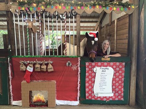 My horse's Christmas stall for our 2015 stall decorating contest... I revisited our "Naughty List" theme from a few years back. Apache's name is at the top of the naughty list (as always!), coal in his stocking that is hanging from the mantle above the fireplace, and new this year... A cardboard mounted deer head (from target) and dollar store lights on its antlers to hang over the mantle. I also added a "bah humbug" banner hanging across the front (since he was grumpy from being on the naughty Fair Horse Stall Decorations Ideas, Horse Christmas Parade Ideas, Christmas Horse Stall Decorating Ideas, Horse Stall Decorations For Fair, Christmas Donation Ideas, Christmas Decorated Horse Stall, Horse Barn Christmas Decorations, Horse Stall Decorations, Horse Barn Decor