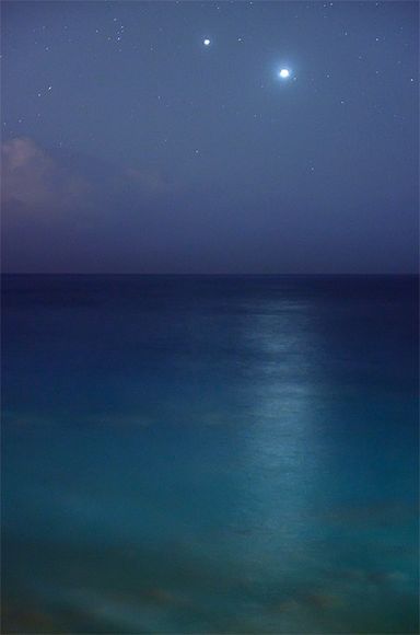 Planetary Reunion    Photograph courtesy Luc Perrot    Venus (right) and Jupiter appear to meet in the sky over the French island of Réunion in a recently released picture of this month's planetary conjunction.    Also called the evening star, Venus is the brightest planet we can see with the naked eye, due in part to its thick, highly reflective atmosphere and its closeness to Earth. Venus And Jupiter, The Evening Star, French Island, Jacques Yves Cousteau, Evening Star, Behind Blue Eyes, Star Ocean, Pinterest App, Fb Cover