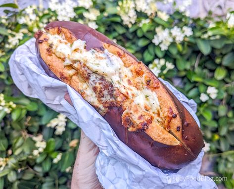 We Found Our Favorite NEW Disney Pretzel, But NOT Where You Might Think | the disney food blog Cheesy Garlic Pretzel Bread, Disneyland Cheesy Garlic Pretzel Bread, Disney Dishes Recipes, Garlic Pretzel Recipe, Disney Pretzel, Garlic Twist, Pretzel Sandwich, Pretzel Bread, Disney Dishes