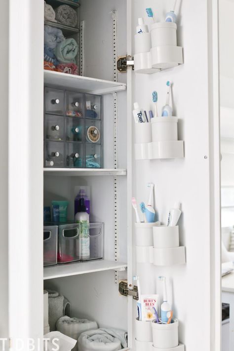 Toothbrush Storage Small Bathroom, Bathroom Cubby Organization, Large Family Toothbrush Organization, Large Family Bathroom Organization, Where To Put Toothbrush In Bathroom, Small Family Bathroom Storage, Bathroom Cubbies, Toothbrush Storage Ideas, Bathroom Cabinet Organization Ideas