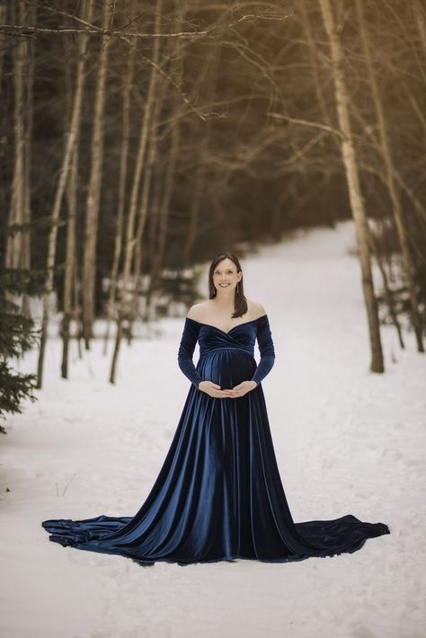 Outdoor maternity session in Edmonton Alberta during the winter months Blue Maternity Photoshoot, Winter Wonderland Outfit, Winter Pregnancy, Maternity Photoshoot Dress, Blue Velvet Gown, Maternity Pics, Winter Maternity, Outdoor Shoot, Velvet Gown