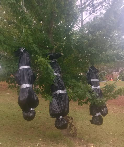 Halloween decorations! Fake body bags hanging from front tree- stuffed old clothes with newspaper inside trash bags strategically wrapped with contrasting duct tape. Halloween Decor, Halloween Decorations, Halloween Costumes, Yard, Halloween