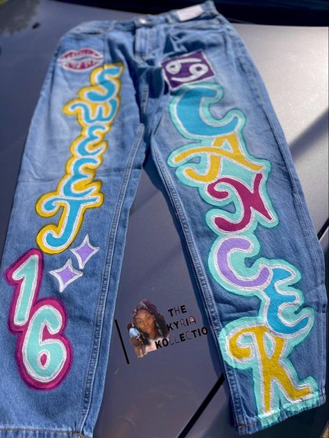 Sweet 16 Birthday Jeans, Customized Birthday Jeans, Zodiac Pants Photoshoot, Zodiac Sign Pants Photoshoot, Custom Jean Birthday Outfits, Birthday Pants Ideas, Spray Paint Birthday Outfit, Sweet 16 Custom Outfits, Painted Birthday Pants