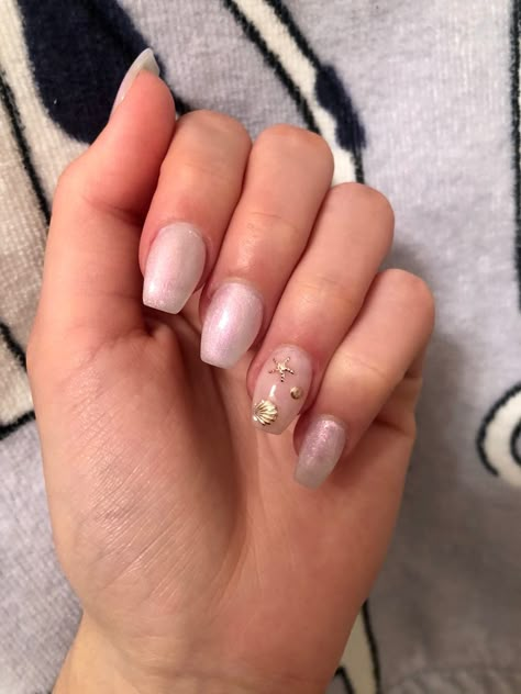 Nude gel acrylic nails with gem embellishments Gold Starfish Nails, Summer Beach Acrylic Nails, Starfish French Tip Nails, Starfish Acrylic Nails, Sea Theme Nails, Nails With Shells, Glitter Ballerina Nails, Starfish Nails Beach Themes, Nails With Starfish