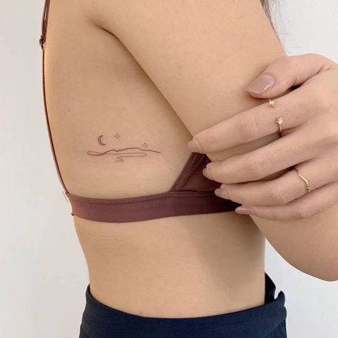 Below Rib Tattoo, Small Rib Tattoo Placements, Rib Moon Tattoos For Women, Subtle Moon Tattoo, Rib Tattoo Minimalist, Small Flowy Tattoo, Rib Moon Tattoo, Cute Spots For Small Tattoos, I Was Not Born To Drown Tattoo