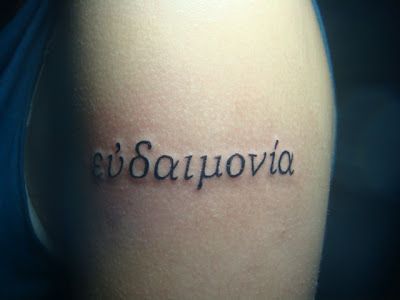 Eudaimonia tattoo - Loose translation from Greek is happiness, but isn't quite the same thing as what we'd probably consider 'happiness' to be today. Eudaimonia Tattoo, Believe Wrist Tattoo, Human Flourishing, Love Wrist Tattoo, Wrist Tattoos Words, Greek Tattoo, Alchemy Tattoo, Meaningful Wrist Tattoos, Bird Tattoo Wrist