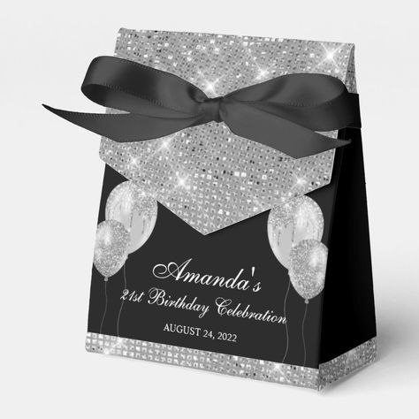 This customizable favor box is the epitome of glamour with its black and silver design. Featuring faux silver glitter and balloons, it's the perfect addition to any celebration, from birthdays to anniversaries to conventions. The best part? There's plenty of space for you to add your own text and make it truly your own.  If you're looking for some inspiration on how to use this customizable favor box, here are some ideas:  1.Customize it with the name of the guest of honor and use it as a party Black And Silver Wedding Theme, Black And Silver Party Theme, 60th Birthday Favors, Silver Wedding Theme, Personalized Favor Boxes, Dyi Gifts, Mystery Party, Silver Party, Party Essentials