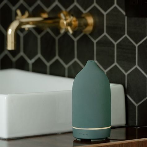 Surround yourself with delicate mist and irresistible scents. In a matte blue-green hue inspired by the sea, this ceramic diffuser looks lovely as it infuses the air with aromatic botanical essences sold separately. Fill the electronic diffuser with water and 20 to 25 drops of your favorite essential oil for a spa-like experience in any room. Choose between continuous and intermittent misting to create a scent experience that suits you perfectly. This modern-organic diffuser makes an excellent g Ceramic Diffuser, Cream Bathroom, Essential Oils Kit, Essential Oil Set, White Ceramic Vases, Modern Organic, Ceramic Floor, Candle Diffuser, Surround Yourself