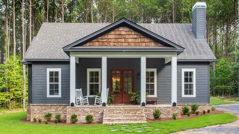 Check out our 1600 sq/ft Bungalow Cottage in the Woods. Visit our website to view house plans. #cottage #bungalow #craftsmancottage #graycottage #graybungalow #smallhomeplans #cottagehomeplans #bungalowhomeplans #firsthomeplans #under2000sqfthomeplans #homeplans Storybook Bungalow, Porch Plans, Back Porches, Gray House, Cedar Shakes, Plans Architecture, Country House Plan, Casa Exterior, Farmhouse Plan