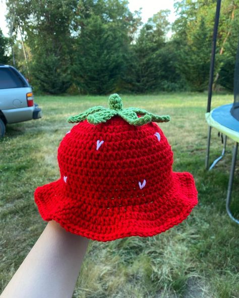 Red strawberry crochet bucket hat with white seeds and green stem Strawberry Hat Crochet Pattern, Crochet Strawberry Hat, Strawberry Shortcake Crochet Hat, Crochet Strawberry Bucket Hat, Crochet Bucket Hat Strawberry, Strawberry Bucket Hat, Handmade Red Crochet Bucket Hat, Strawberry Hat, Crafting Table