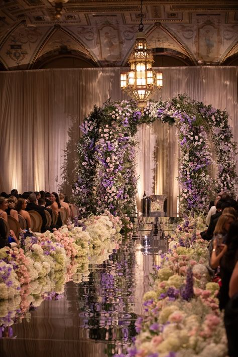 We wanted to ceremony to feel like a wildflower garden fairytale. The soft pinks, blues, purple and yellow wildflowers led up to our elevated chuppah. We saved the dreamy romantic white designs for the wedding reception which made for a dramatic change in tone. When Alex and I first had our room reveal for the reception, we were speechless: the hydrangea clouds, eclectic tablescapes and thousands of candles filled the room with romance and warmth