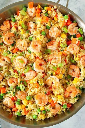 This Shrimp Fried Rice Recipe is the fastest and easiest takeout dinner you can make at home! You only need shrimp, leftover rice, frozen veggies, soy sauce and 15 minutes to turn it into delicious dinner. Shrimp Rice And Veggies, Thai Shrimp Fried Rice, Easy Shrimp Fried Rice Recipe, Amazing Food Recipes, Rice With Shrimp, Shrimp Fried Rice Recipe, Shrimp And Rice Recipes, Thai Shrimp, Shrimp Recipes Healthy