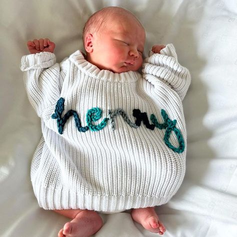 welcome earth side sweet sweet baby Henry 🥹 I loved making this sweater for you 💙🩵🌎 wearing a frost 0-3 month 💗💗 | Instagram Sweater Milestone Pictures, Personalized Baby Sweater, Newborn Name Sweater, Name Sweater Baby, Embroidered Baby Name Sweater, Baby Name Announcement, Baby Boy Sweater, Newborn Announcement, Monthly Baby Pictures