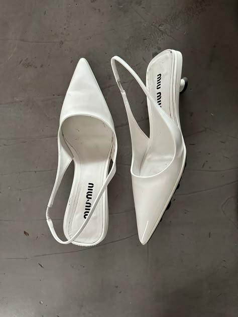 Miu Miu heels laying on the floor Miu Miu White Shoes, White Miu Miu Heels, Pointed Heels Aesthetic, White Office Shoes, Miu Miu Footwear, Miu Miu Wedding Shoes, White Kitten Heels Aesthetic, Kitten Heel Shoes Classy, Vintage Pointed Heels