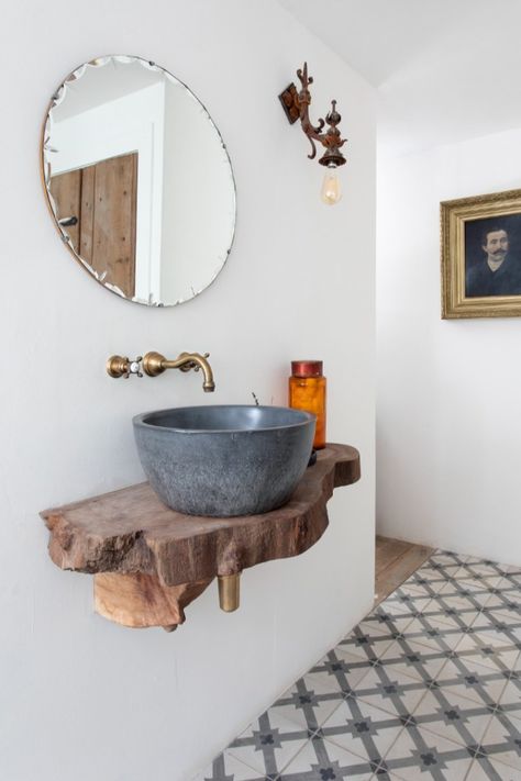 One of the best ways to create a timeless and tactile bathroom is through the use of natural materials. Here, Stef and Simon of @kilmartincastle have created a striking bespoke vanity unit by combining a Perrin & Rowe Aged Brass tap with a stone vessel basin placed on a timber offcut for a sustainable solution and organic look. As the brassware is deliberately unlacquered it will take on a unique patina over time for a vintage feel. #bathroomdecor #bathroomvanity #neutralbathrooms #bathroomidea Stone Sink Table, Pebble Sink Bathroom, Reclaimed Tile, Wood Sink, Round Sink, Concrete Bathroom, Timeless Bathroom, Wooden Vanity, Concrete Sink