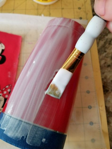 Using mod podge to make a fabric tumbler.  Learn how to cover and apply epoxy to make a Disney cup. #disney #tumbler Disney Tumbler, Minnie Mouse Fabric, Red Spray Paint, Disney Cups, Glitter Tumbler Cups, Cup Crafts, Custom Tumbler Cups, Diy Cups, Tumbler Cups Diy