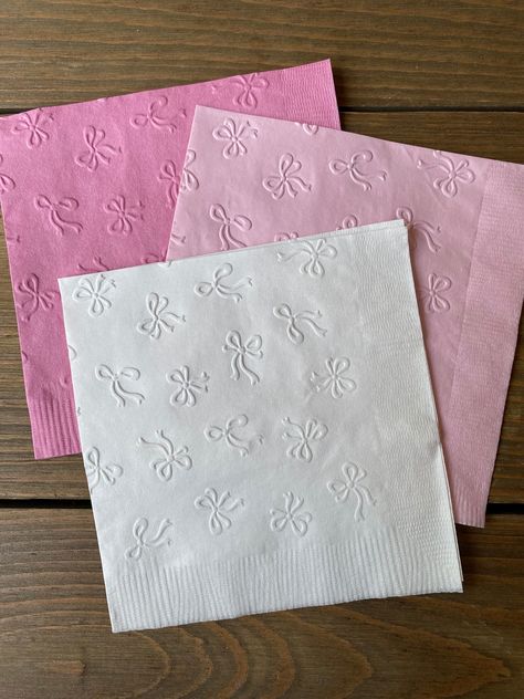 Perfect touch to your shower or get together!  Hand embossed napkins:  Each napkin folded measures 5" x 5" Drink/Cake napkin Each set contains 20 embossed napkins If you need a certain color that you don't see, please message me prior to purchase.  *If you would like half you order one color and the other half another color, just put that in the notes section, I'm happy to help!  Example: 10 light pink 10 white (20 napkins per set) Places To Have Birthday Parties, Princess First Birthday Party Decorations, Princess Diaries Baby Shower Theme, Pink Ribbon Baby Shower Theme, Bailarina Birthday Party, Girly Party Decor, Birthday Party Mood Board, Sweet 16 Bow Theme, Pink Backyard Party