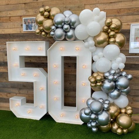 Celebrating a milestone in style! An organic balloon garland in shades of gold, silver, and white, positioned on our 4ft light up numbers are the perfect statement piece for capturing those milestone memories. Whether it’s a birthday, anniversary, or another special occasion, this setup is perfect and fits most spaces in venues or at home. Venue - @cliffhousebarton #balloonsetups #balloonsdecoration #balloons2buisness #balloons🎈 #birthdayballoons🎈 #balloonsforalloccasions #50thanniversa... Light Up Numbers, Balloon Displays, Balloon Display, 5 Year Anniversary, Business Party, Shades Of Gold, Balloon Garland, Birthday Balloons, Birthday Anniversary