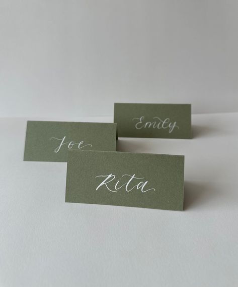 For a beautifully personalized touch, add your guests' names to your order! Email them to thoughtfullymadeuk@outlook.com or include them in the order notes at checkout.  These elegant, matte-finished, tented place cards are handcrafted with stunning calligraphy, making a memorable addition to your wedding or event decor.  Track your order (excluding samples!), with estimated dispatch times adjusted for seasonal demand.  Rush orders welcome - just send us a message. 
.#WeddingInvitations #DIYWedding #WeddingStationery #WeddingInspiration #WeddingPlanning Calligraphy Table Names, Wedding Name Place Cards Elegant, Folded Name Cards Wedding, Seating Plan Design, Handmade Wedding Place Cards, Table Labels Wedding, Rustic Wedding Place Cards, Name Tag Wedding Table Seating Charts, Namecard Wedding Table