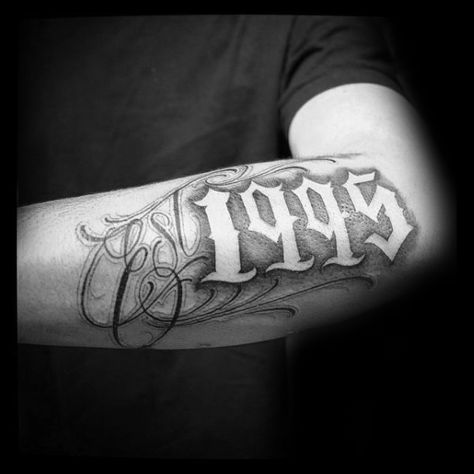 Cool 1995 Negative Space Guys Est Outer Forearm Tattoo 2004 Tattoo Design, Est Tattoo, Est Tattoos, Est. Tattoo, Traditional Chicano Tattoos, Art Chicano, Outer Forearm Tattoo, Chicanas Tattoo, Number Tattoos