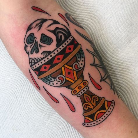 Joshua Gilbert on Instagram: “Skull and chalice for @b.colesy Thanks heaps dude. . . . . . . . . #tattoo #trad #traditional #tradtattoo #traditionaltattoo…” Chalice Tattoo Traditional, Traditional Goblet Tattoo, Chalice Tattoo Design, Traditional Medieval Tattoo, Medieval Traditional Tattoo, Trad Skull Tattoo, Goblet Tattoo, Skull Tattoo Traditional, Traditional Candle Tattoo