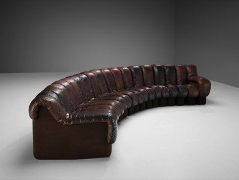 A design by Ueli Berger, Elenora Peduzzi-Riva, Heinz Ulrich and Klaus Vogt for De Sede, Switzerland. This De Sede modular 'Snake' sectional sofa contains nineteen pieces in original patinated brown leather upholstery, of which seventeen centrepieces and two higher armrests. #sectionalsofa #modularsofa #modulardesign #leathersofa #desede #swissdesign #collectibledesign #midcenturymoderndesign #DS-600 #desede #leather #modular #modularsofa #desede #heinzulrich #ueliberger #architecture #design Swiss Design, Design Gallery, Modular Design, Dark Brown Leather, Mid Century Modern Design, Modern Retro, Color Shades, Leather Upholstery, Leather Sofa