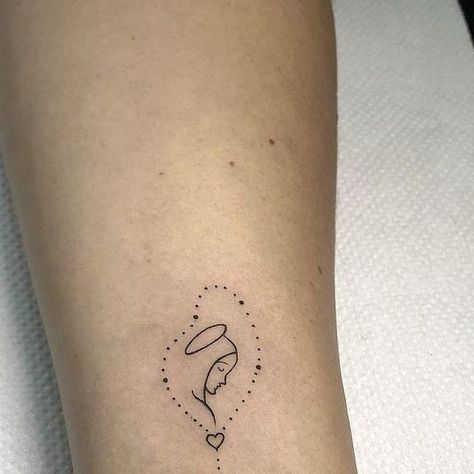 Fallen Sparrow Tattoo on Instagram: "Tiny ink, boundless spirituality!   Fine line virgin mary tattoo by @ginavargastattoo - - - - #virginmary #tinytattoos #fineline #tattooideas #virgen ##bngtattoos #fineline #inked #tattooideas #virginmarytattoo" Simple Mary Tattoo, Small Virgin Mary Tattoo For Women, Virgin Mary Tattoo For Women, Small Virgin Mary Tattoo, Catholic Tattoos For Women, Catholic Tattoos, Virgin Mary Tattoo, Mary Tattoo, Sparrow Tattoo