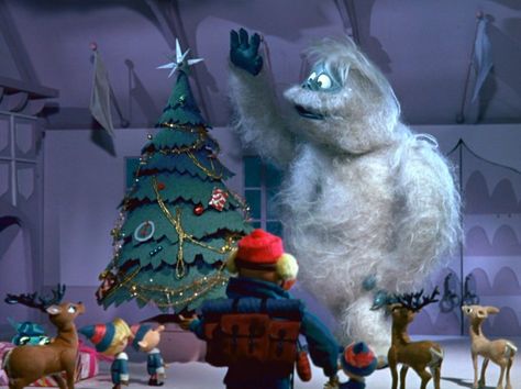 The Bumble, also known as The Abominable Snow Monster, puts a star atop Santa's Christmas tree in "Rudolph the Red-Nosed Reindeer." Best Holiday Movies, Rudolph Red Nose, Rudolph Red Nosed Reindeer, 3d Camera, Classic Christmas Movies, Misfit Toys, Black Christmas Trees, Rudolph The Red, Holiday Movie