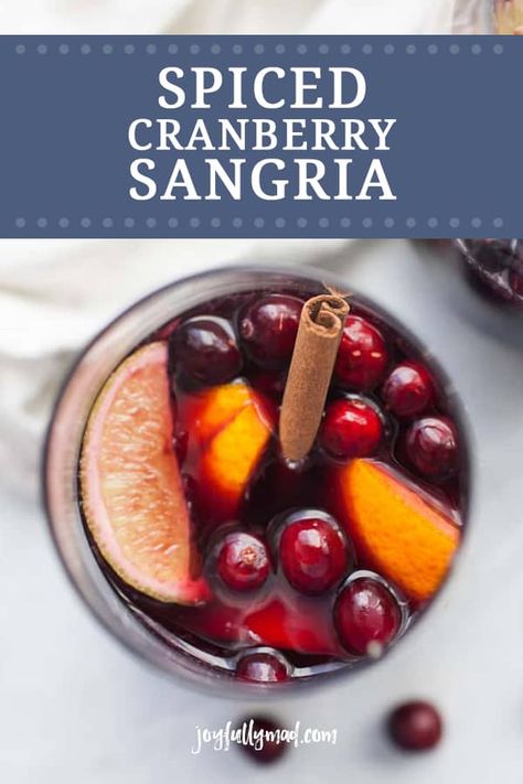 Spiced cranberry sangria is the perfect drink for celebrating this holiday season! This sangria is made with red wine, lime and orange juice, plus fresh cranberries, oranges, limes and cinnamon. Make a batch or a few and gather around with your favorite people to celebrate the season! Cranberry Sangria, Cranberry Simple Syrup, Holiday Sangria, Blender Drinks, Pitcher Cocktails, Thanksgiving Appetizers Easy, Healthy Cocktails, Best Cocktail Recipes, Easy Drink Recipes