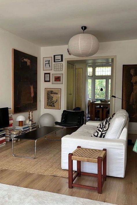 Neutral Retro Living Room, Mid Century Modern New York Apartment, Mix Of Antique And Modern Furniture, Office At Home Aesthetic, Eccentric Coastal, Post Modern Decor, Couch In Middle Of Living Room, Small Nyc Apartment, Nyc Studio Apartment