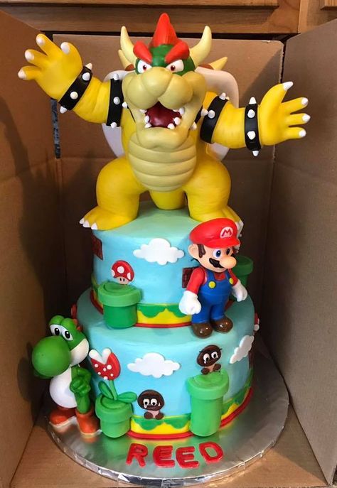 Super Mario Brothers Super Mario Brothers cake with toy characters and fondant accents. Super Mario And Bowser Cake, Super Mario Lego Cake, Mario And Bowser Birthday Cake, Bowser Birthday Party Cake, Super Mario Cake Bowser, Super Mario Movie Cake, Super Mario Theme Cake, Mario And Bowser Cake, Super Mario Cupcakes Birthday Ideas